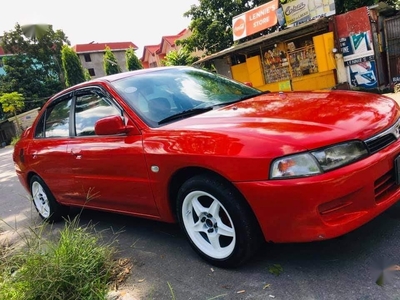 Red Mitsubishi Lancer for sale in Quezon City