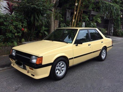 Selling Yellow Mitsubishi Lancer 1987 at 6000 km
