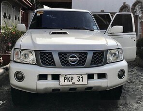 White Nissan Patrol 2013 at 157000 km for sale