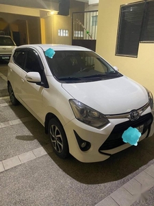 Pearl White Toyota Wigo for sale in Quezon