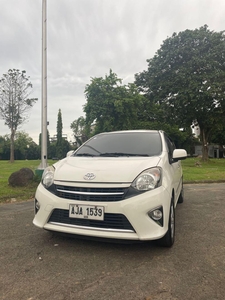 Pearl White Toyota Wigo 2014 for sale in Quezon City