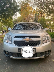 Selling Pearl White Chevrolet Orlando 2014 in Quezon