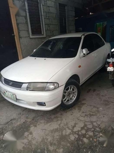 Mazda 323 1999 model first owner for sale ​fully loaded
