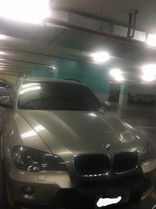 Selling Silver Bmw X5 2010 at 57000 km
