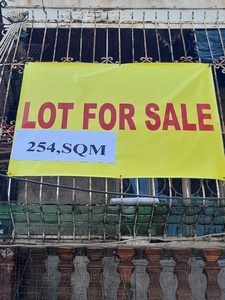 Lot with existing 2 storey building with an L shape lot